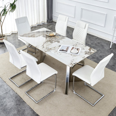 Table and chair set.63'x31.5x30' Luxurious Pandora patterned Sintered Stone Tabletop with Silver Stainless Steel Butterfly Legs.Paried With 6 White High-quality PU Chairs With Arched Metal Legs.